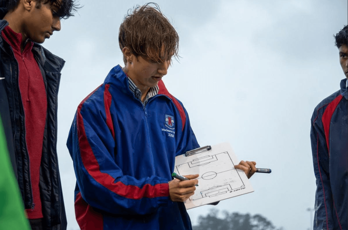 Setting up a formation on a coaching board before a football match